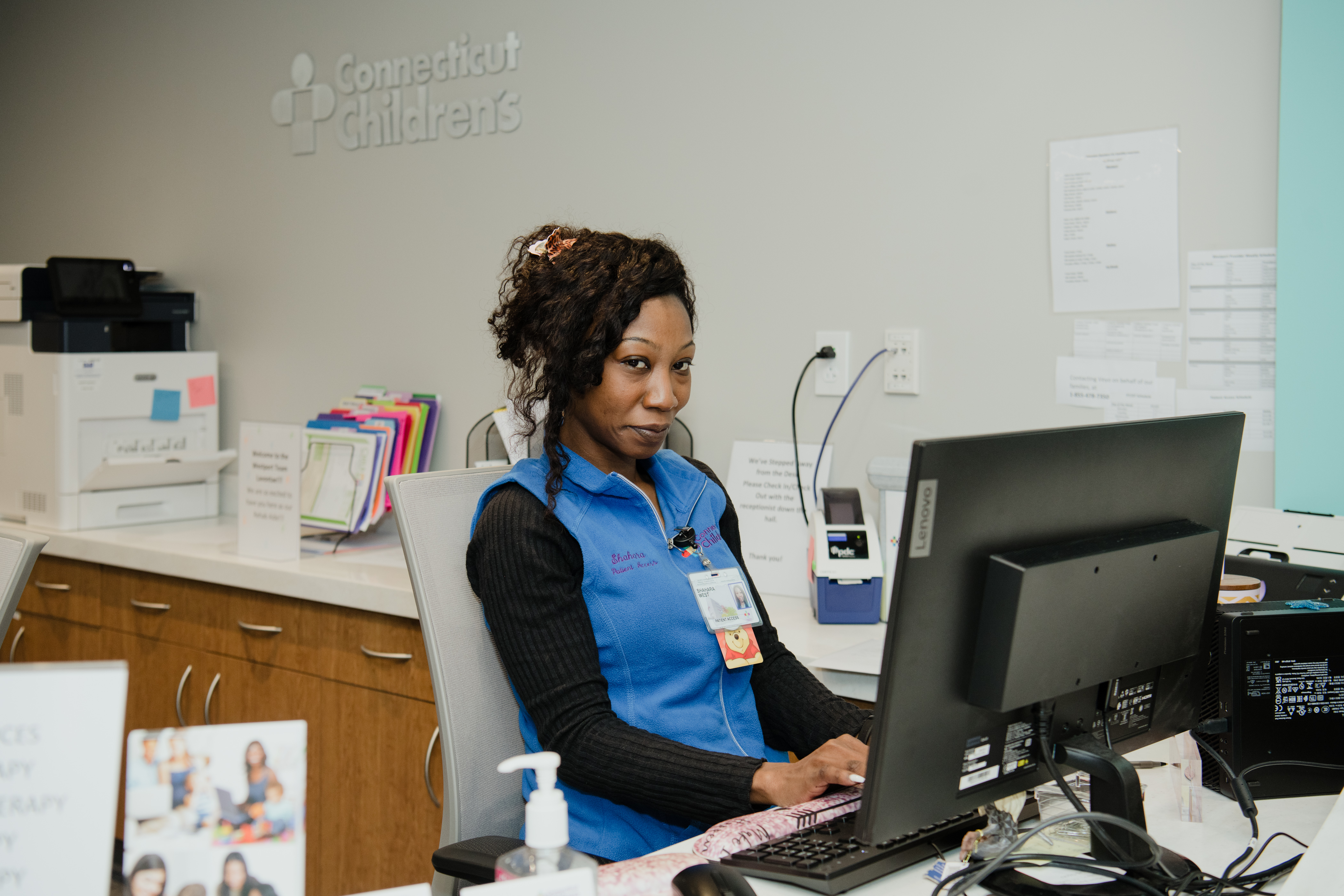 Woman sitting at desk typing