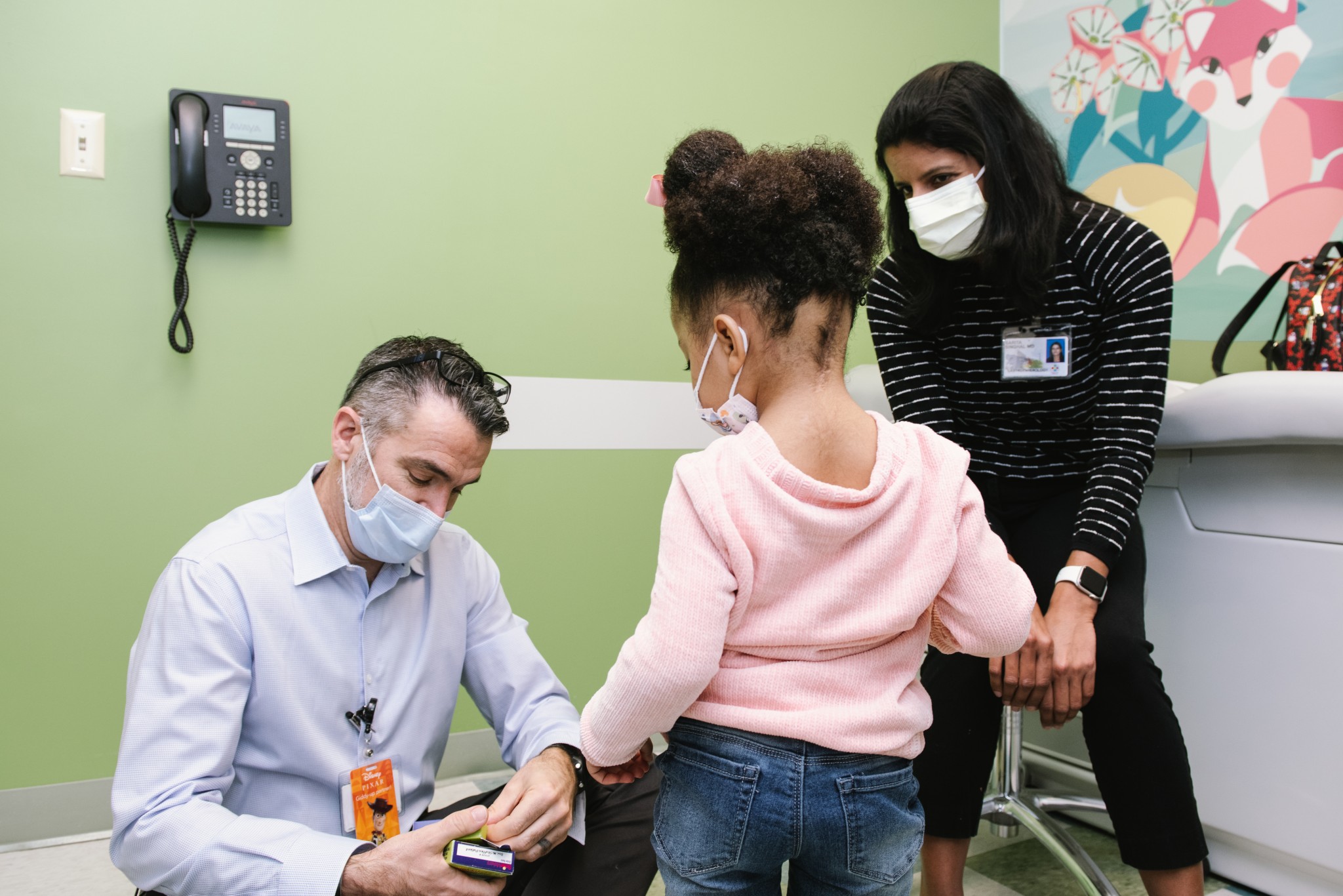 Jazz and her mom with a doctor at Connecticut Children's