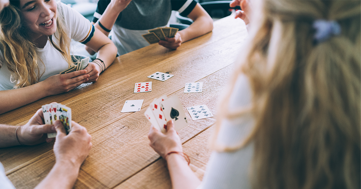 Teens playing cards