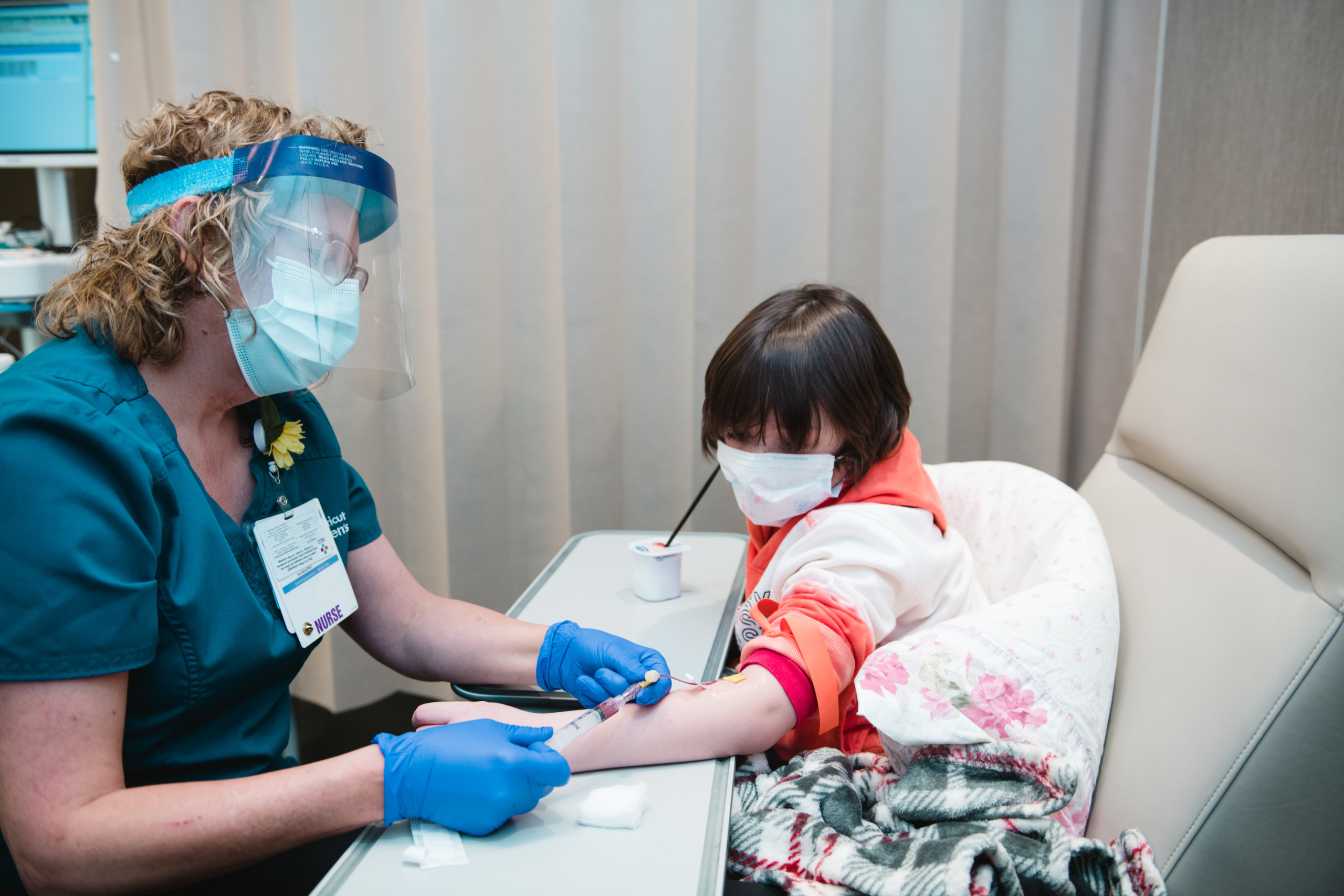 A young girl receiving an infusion