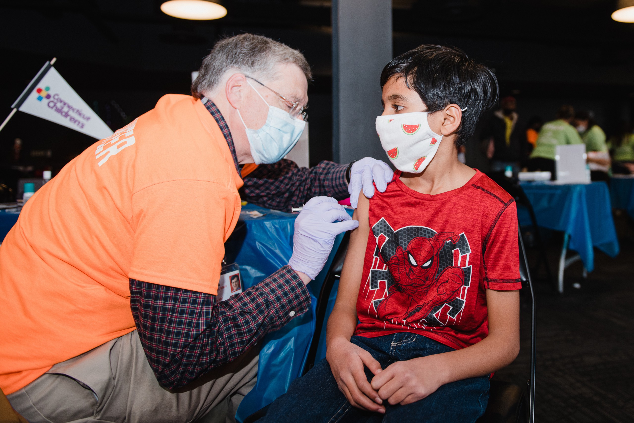 Young boy getting his COVID-19 vaccine