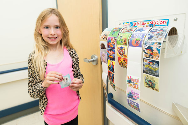 Child taking a sticker