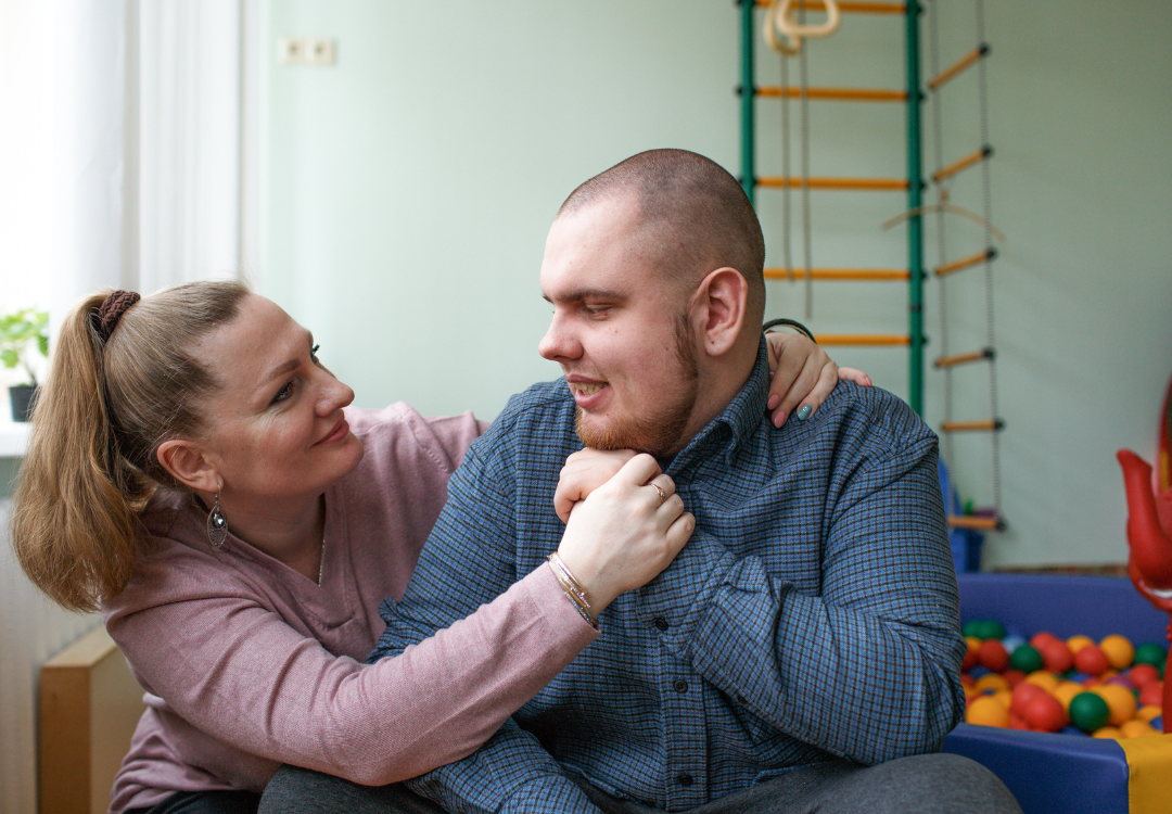 autistic child with caregiver in therapy