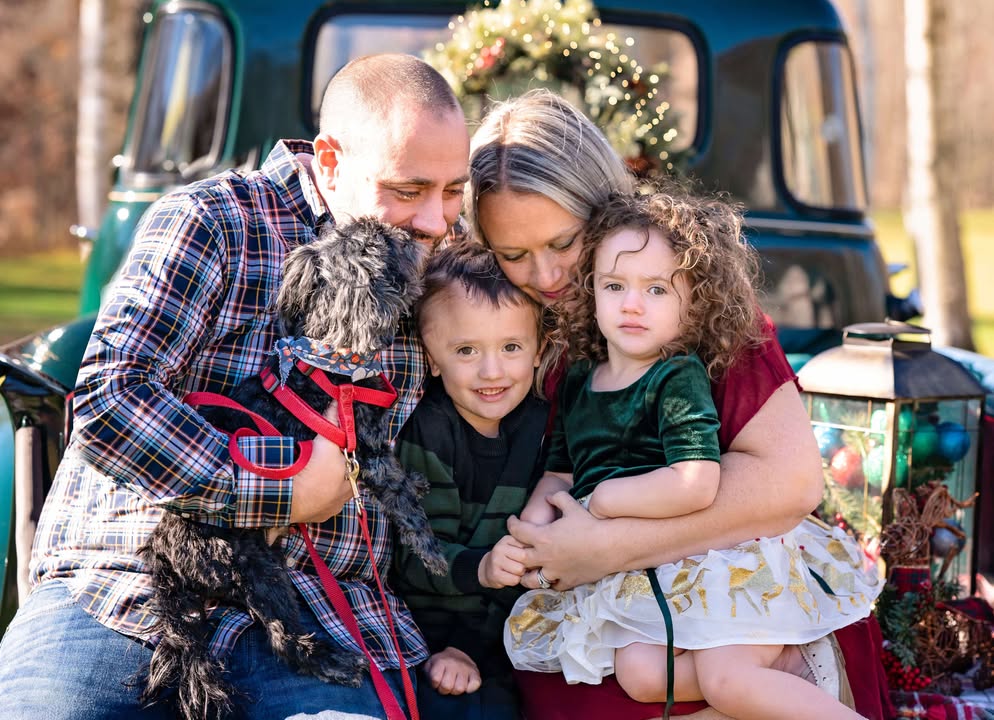 Young boy with little sister, mom, dad and dog