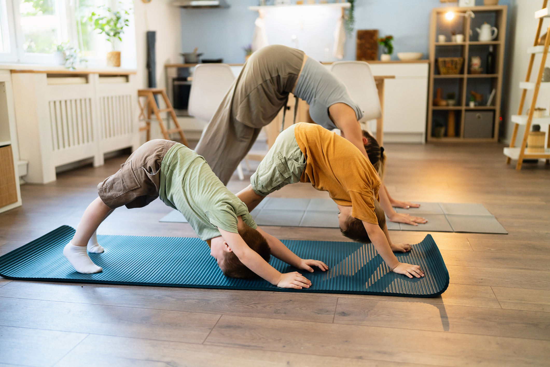 Family doing yoga together. 