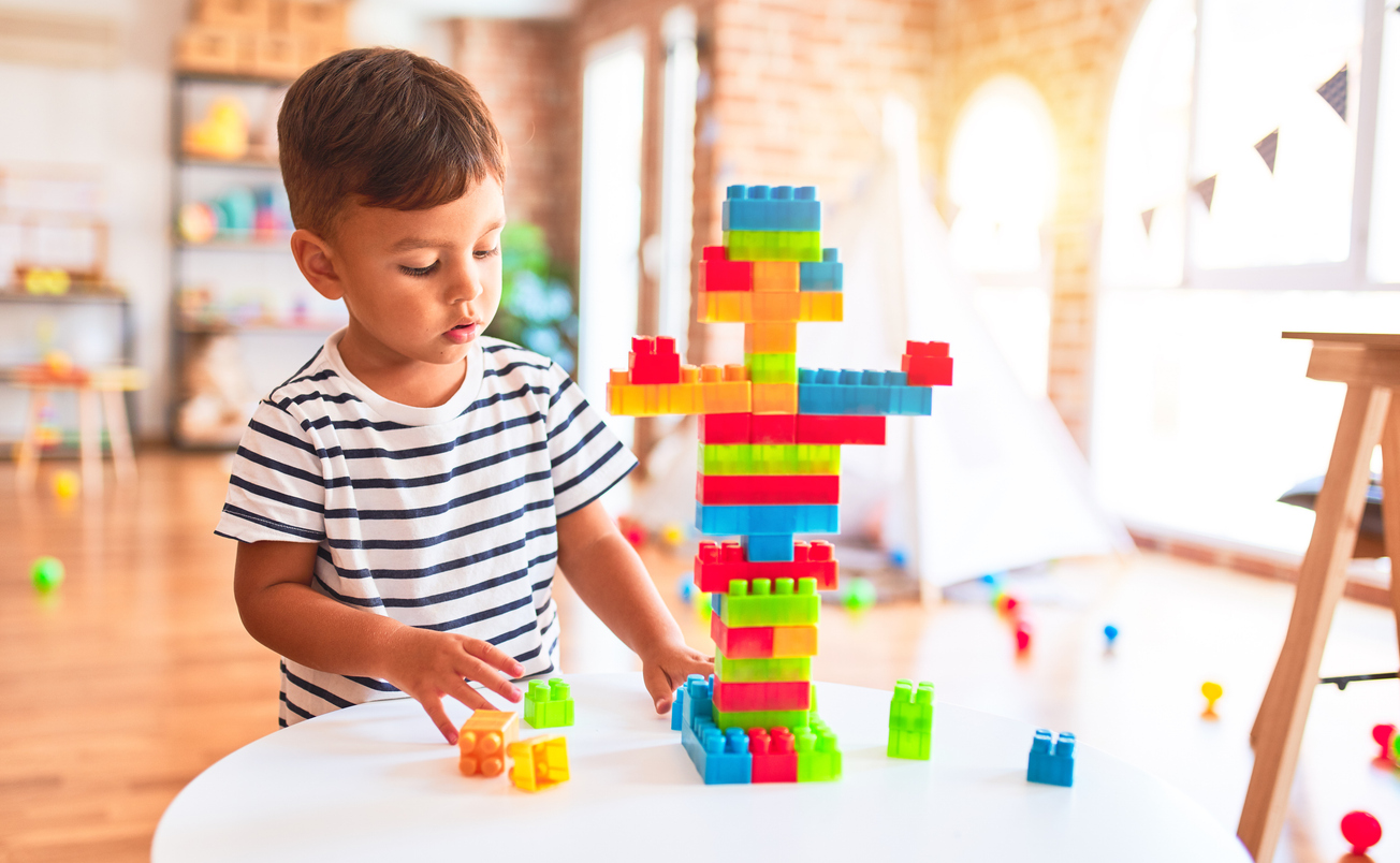 Child Building With Blocks