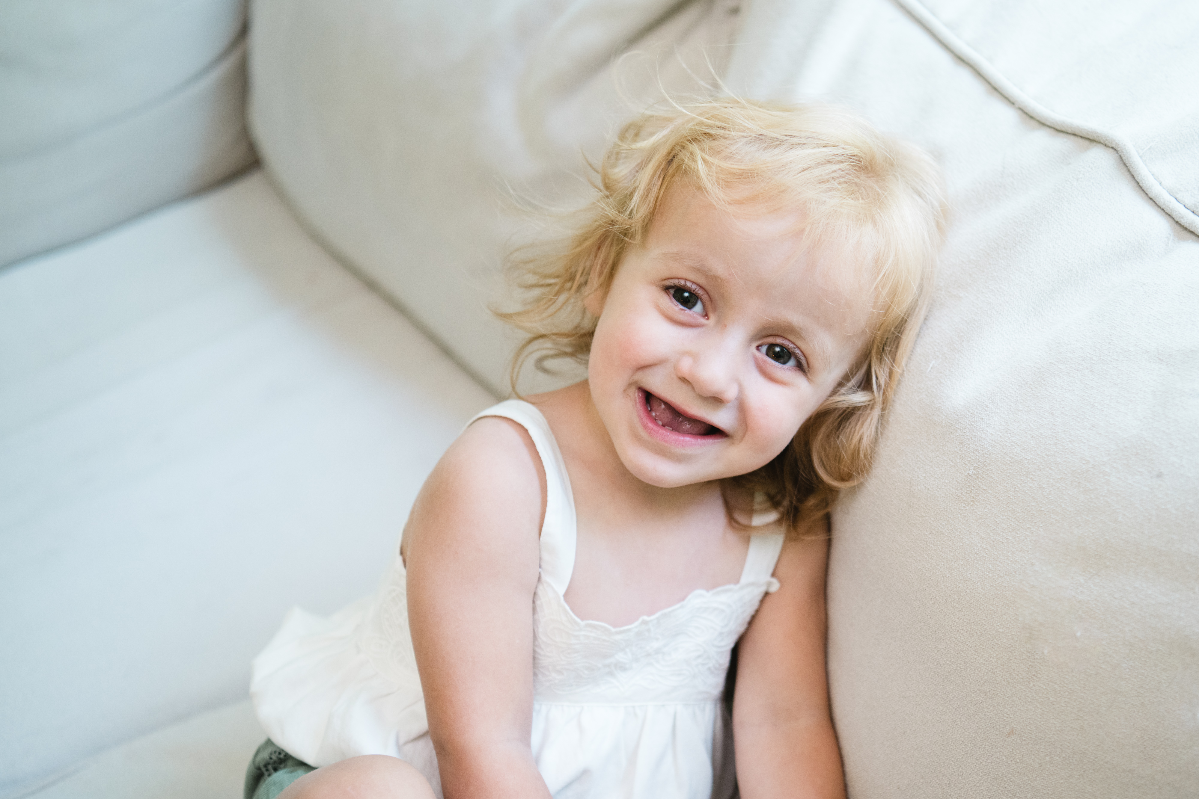 Aria looks into the camera laughing.