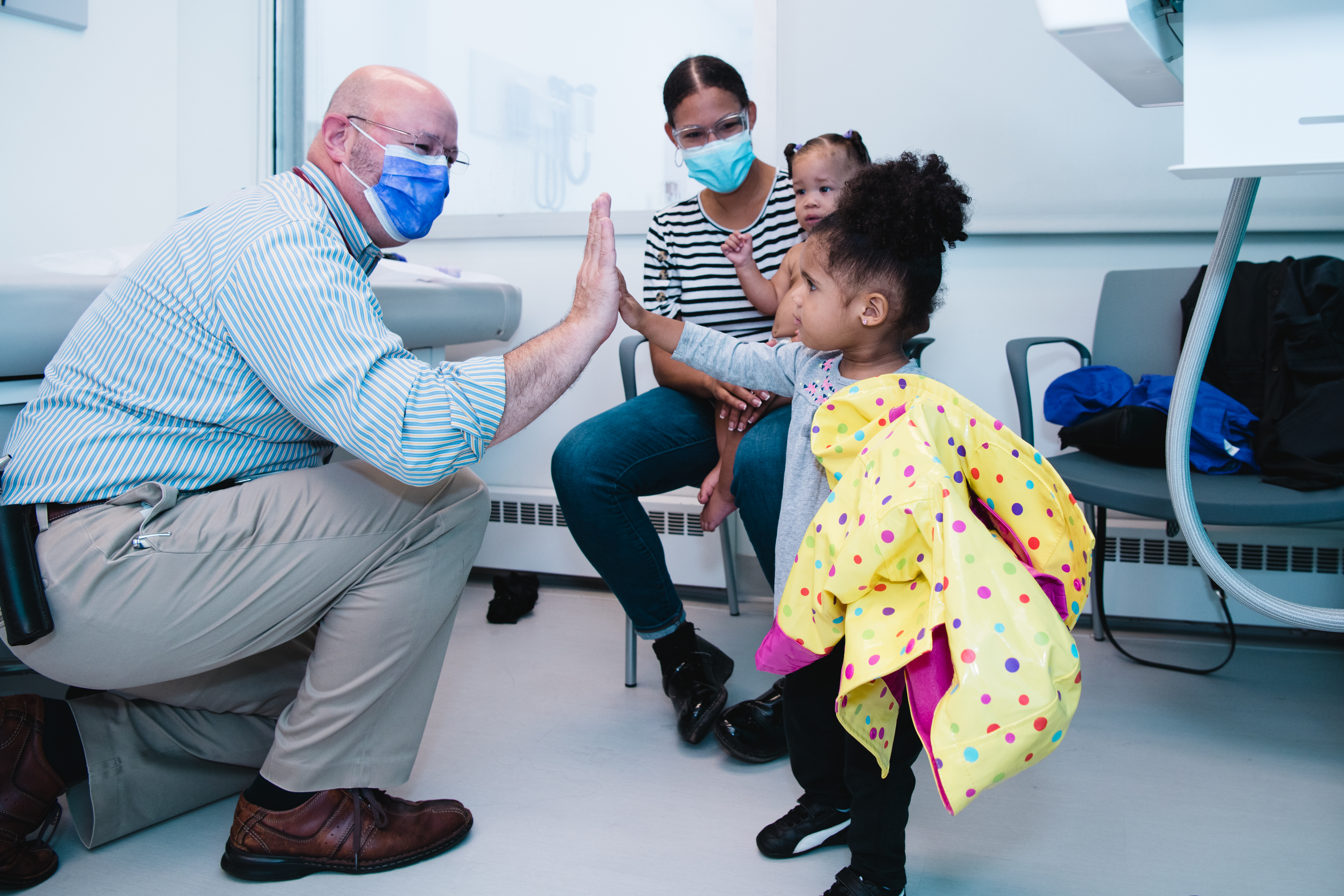 Provider treating toddler patient