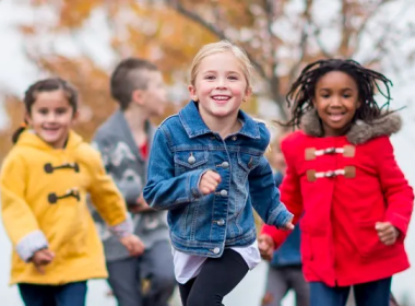 kids running in the snow