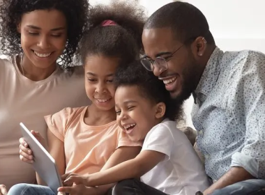 Family looking at a tablet