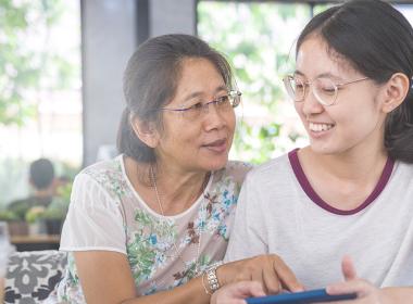 Parent comforting teenager