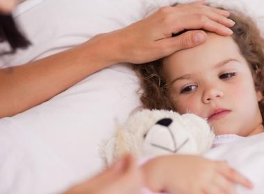 Mother taking care of her sick daughter