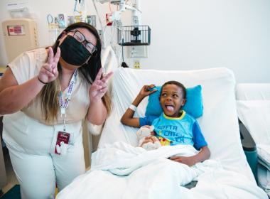 Kelly Ha, founder of the “I See Me” program, poses with a young champion