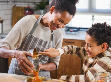 Mother and son baking together