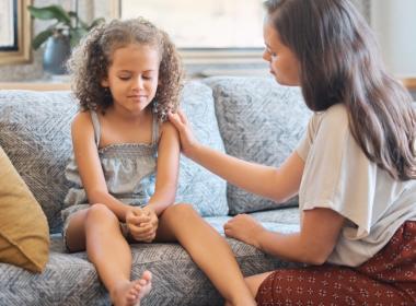 A mother talks to her daughter