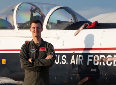 First Lieutenant John Kostal stands (and flies!) proud as a United States Air Force officer.