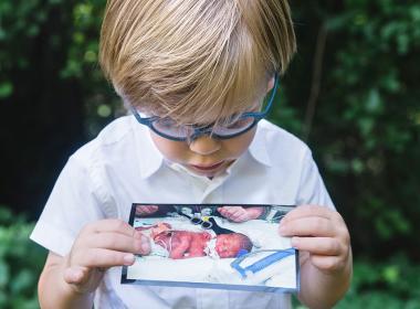 Jack holding his baby picture