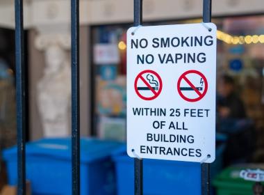 Sign that says "No smoking, no vaping within 25 feet of all building entrances"