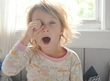 Young girl yawning