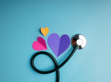 A stethoscope with hearts around it.