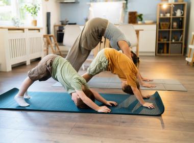 Family doing yoga together.