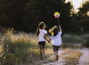 Two girls playing outside