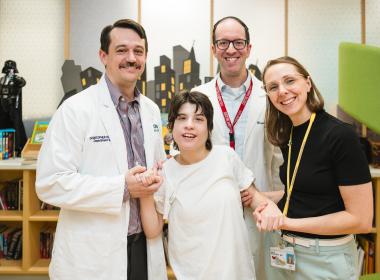 Deep brain stimulation patient with her doctors in the Family Resource Center
