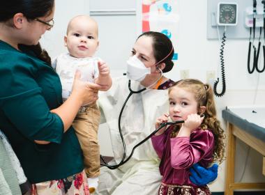 Dr. Collins examines a patient during a Primary Ciliary Dyskinesia clinic.