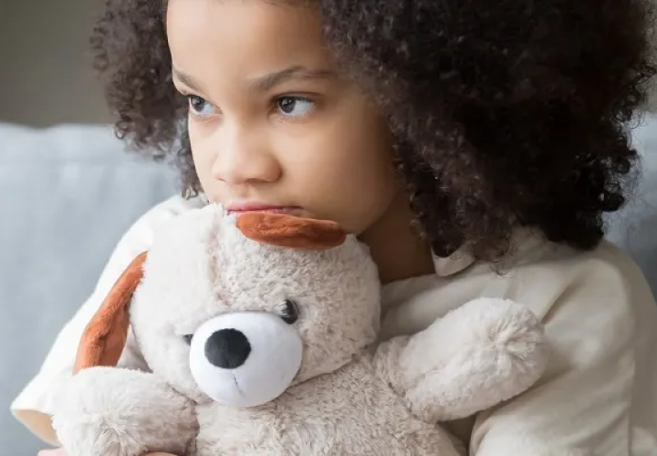Girl holding a teddy bear 
