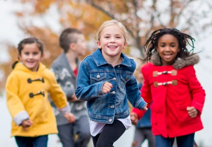 kids running in the snow