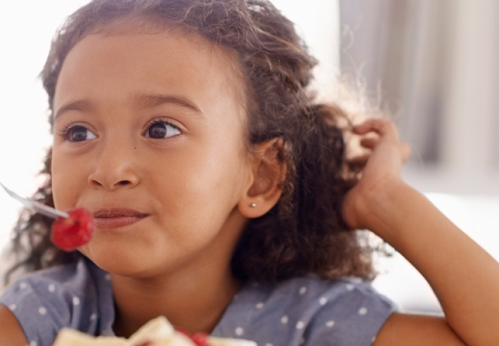 Girl eating fruit