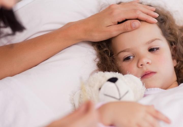 Mother taking care of her sick daughter