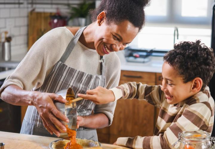 Mother and son baking together