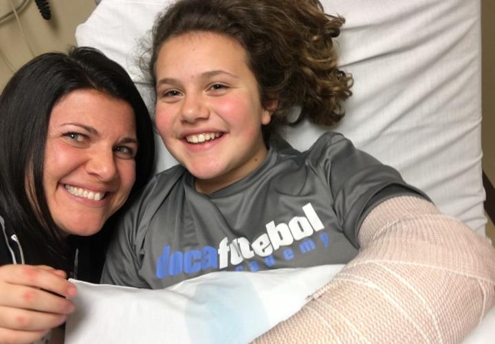 Arianna and Mom, right after wrist surgery at Connecticut Children’s