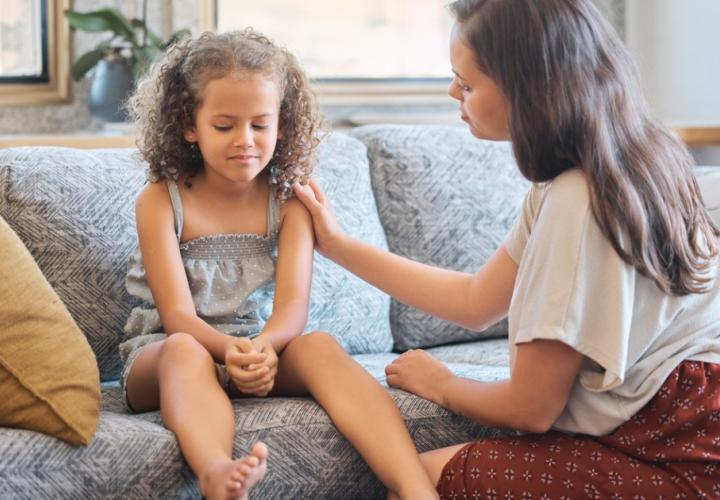 A mother talks to her daughter