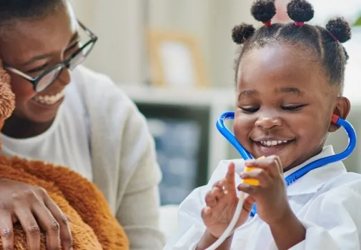 Girl wearing a stethoscope.
