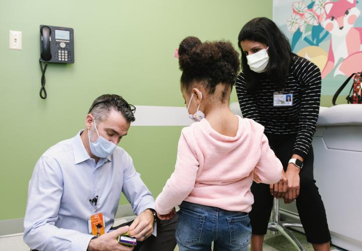 Jazz and her mom with a doctor at Connecticut Children's