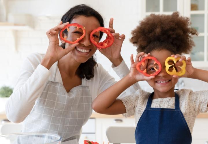 A mother and her daughter cook