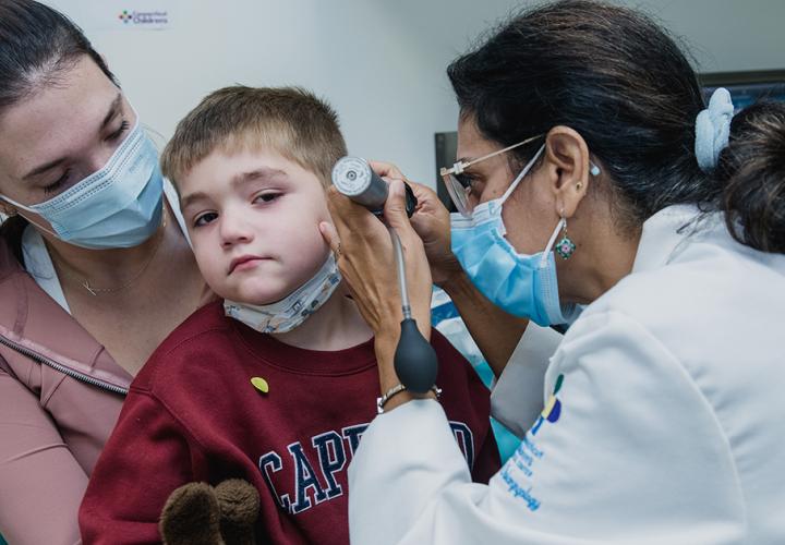 Young boy getting his ears examined