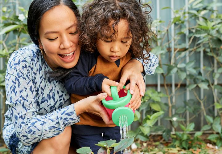 Mother and her child gardening