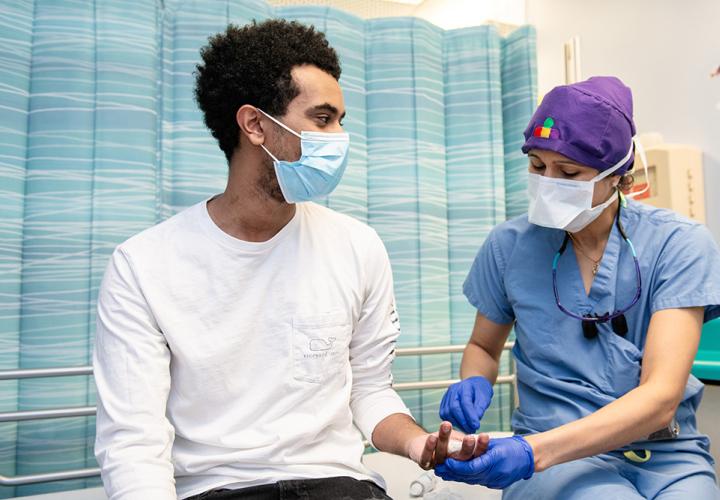 A male teen at the doctor