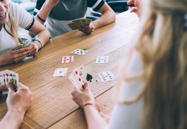 Teens playing cards