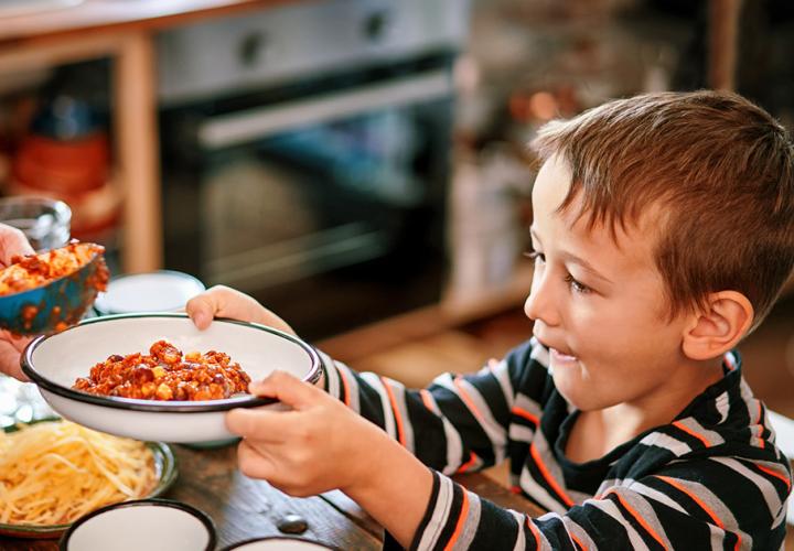 A child accepting a bowl of food