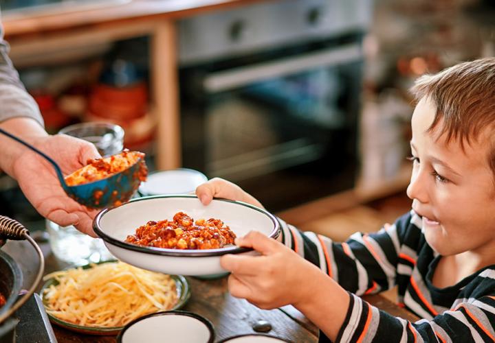 A child accepting a bowl of food