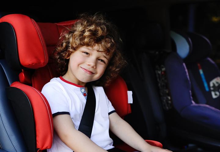 Young boy in his car seat