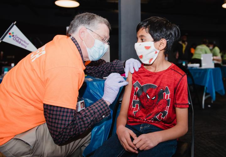 Young boy getting his COVID-19 vaccine