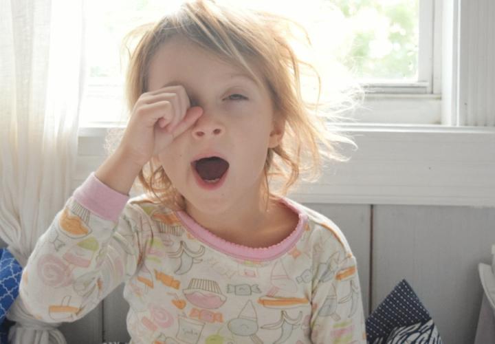 Young girl yawning