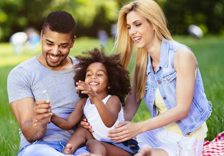 Parents with their young child outside