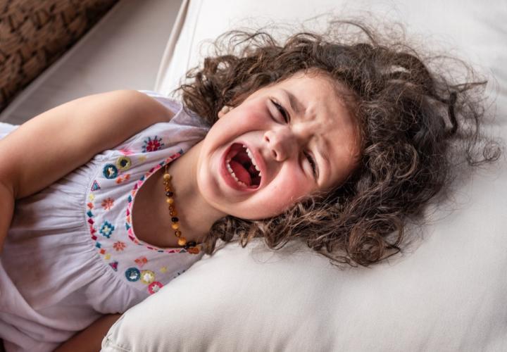 Child screaming in bed