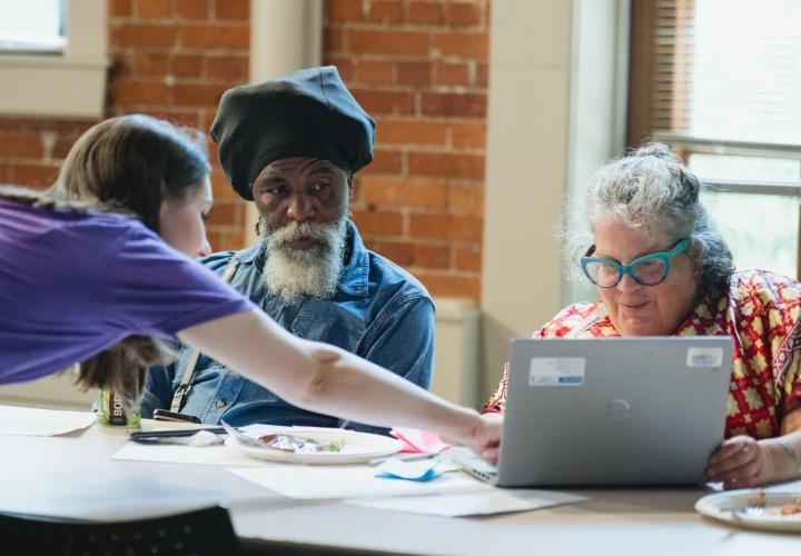 A Lab Specialist working with community members